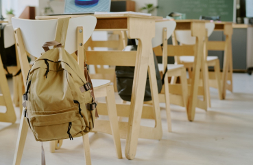 Empty desks with backpacks