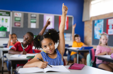 Students with hands raised