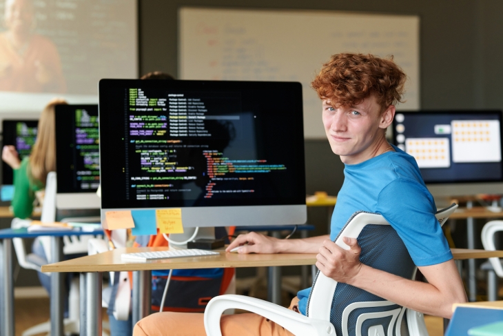 Student coding in classroom