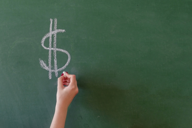 Dollar sign on a chalkboard