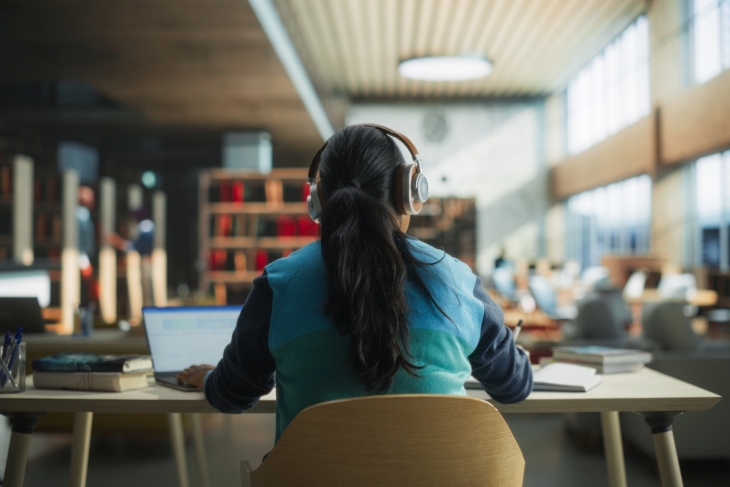 College student studying in library