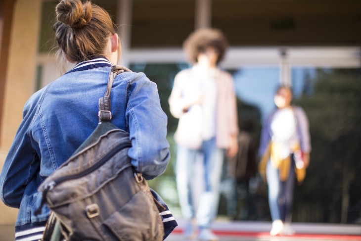 Student entering a school