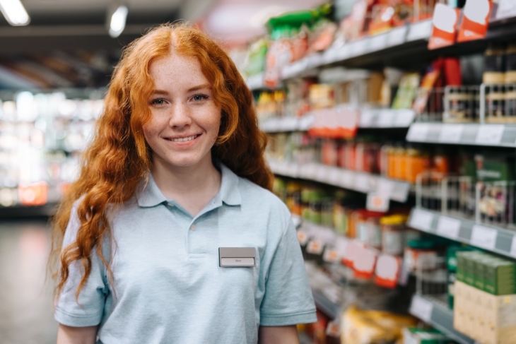 Teenager working in a grocery store