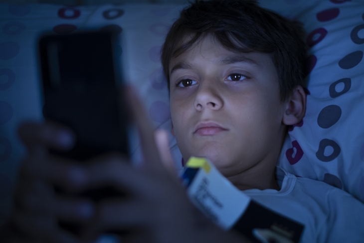Teenager using a cellphone