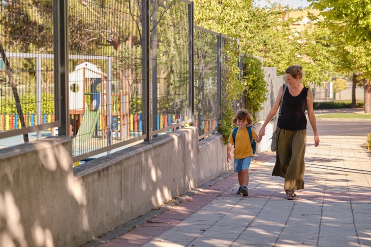 Parent and child walking to school