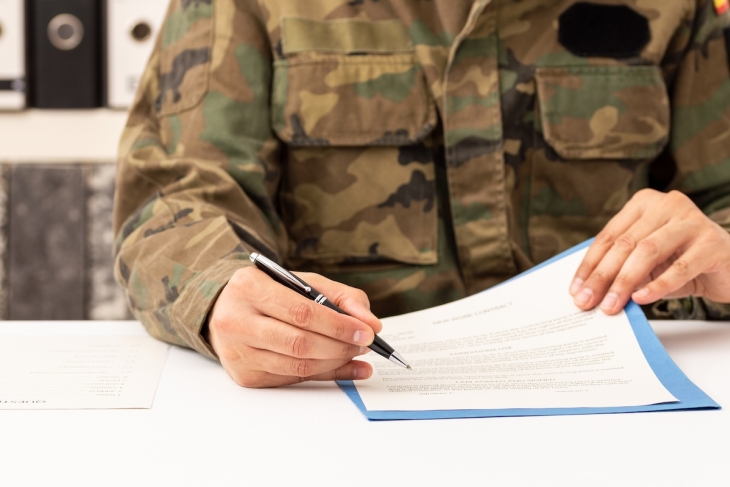 Military personnel writing