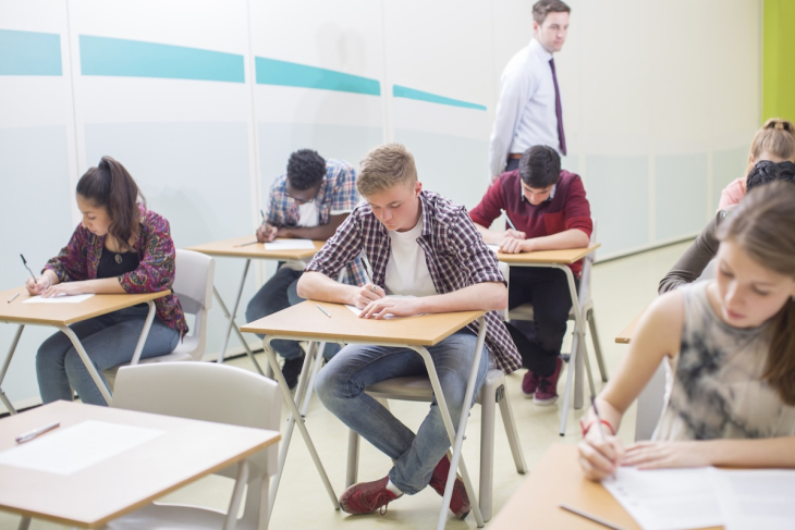 Teenagers taking a test