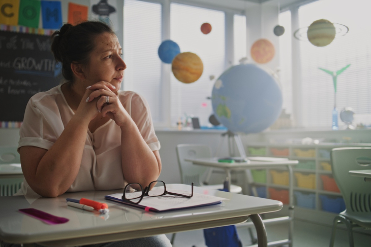 Teacher serious and pondering